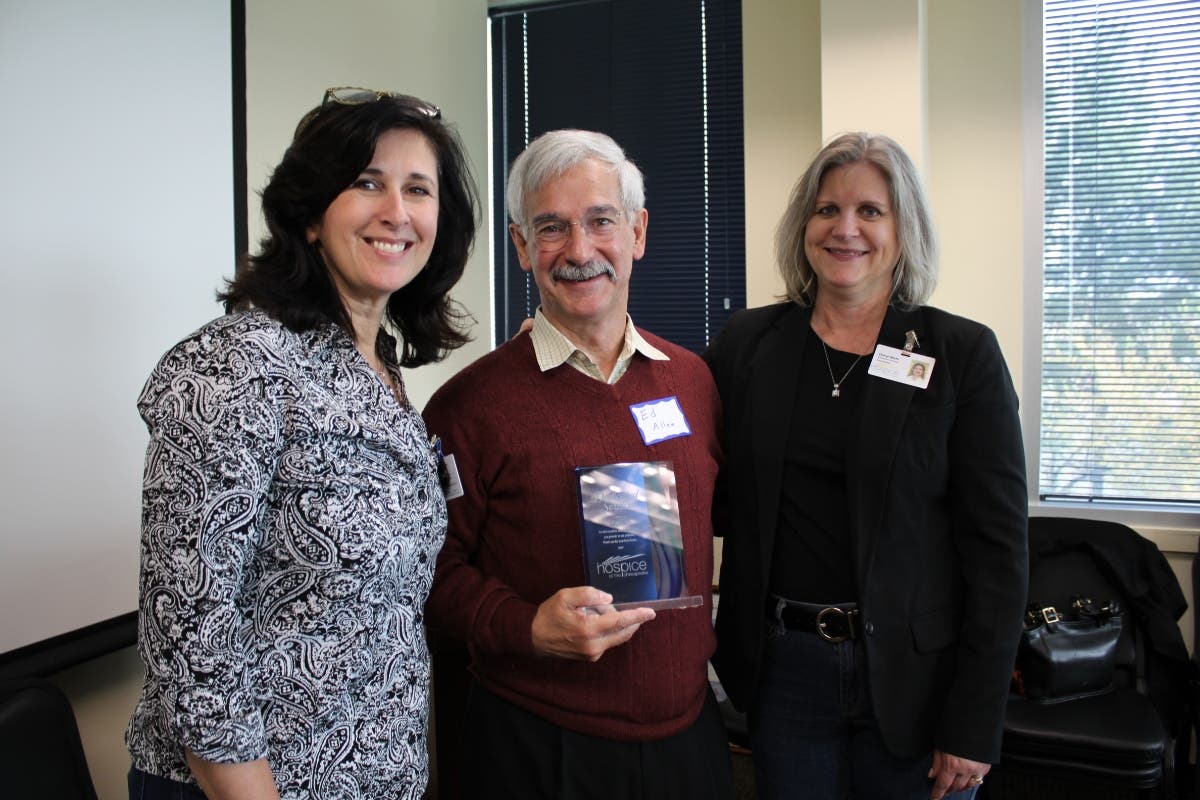 From left, Mary Jermann, Director of Volunteer Services, Ed Allen of Cheverly and Cheryl Michi, VSC