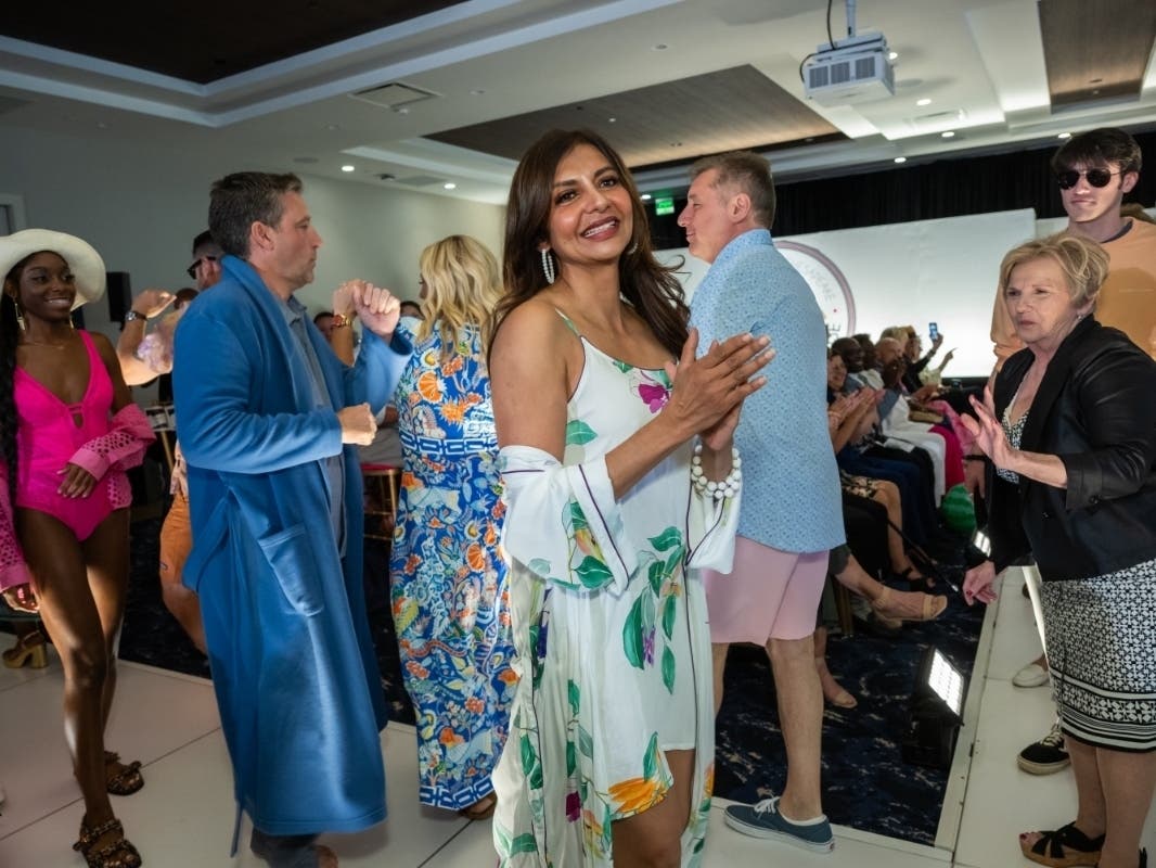 Dr. Parabh Gill turns to the camera as the 33 community models take their final walk on the runway at Hospice of the Chesapeake's Fashion for a Cause, held June 7, at the Fluegel Alumni Center in Annapolis.