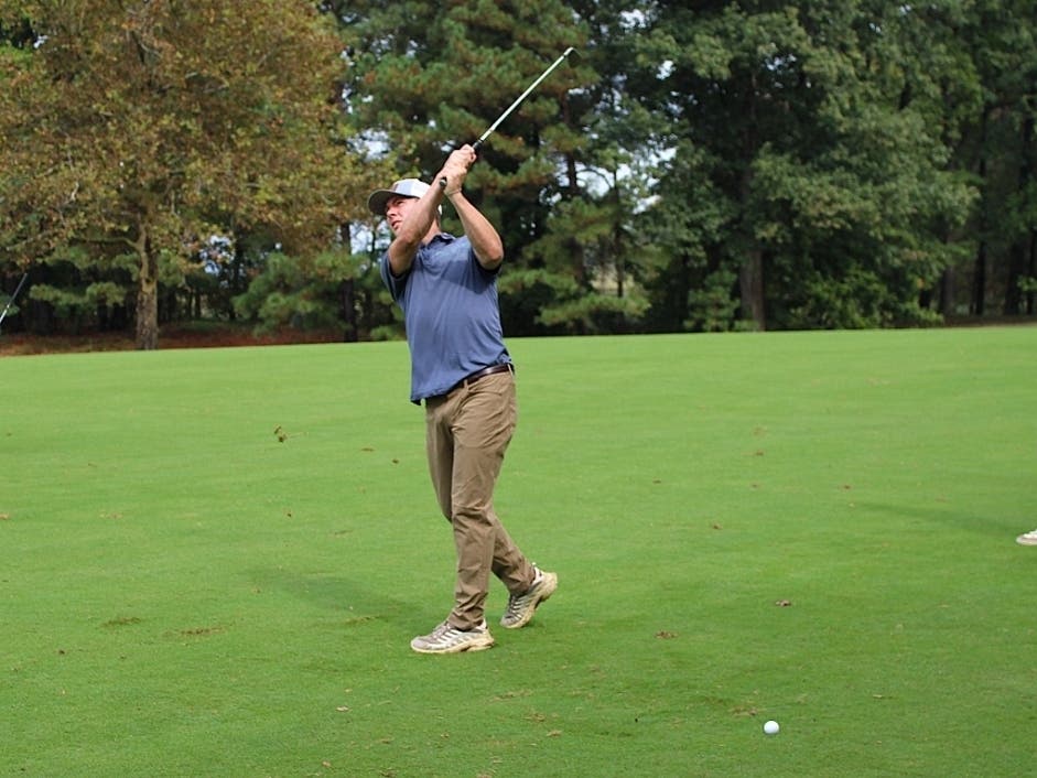 A golfer swings from the fairway during the 2025 Hospice of the Chesapeake Golf Tournament held at Queenstown Harbor Golf. 