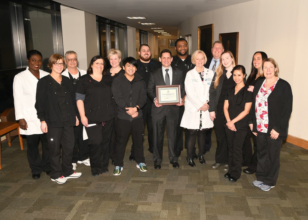 Dr. Kenneth Sable, regional president, southern market, celebrates with the respiratory therapy team.