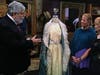 Appraiser C. Robert Harrison (left) of Harrison Appraisals, LLC. evaluates a ball gown worn by a dance partner of President George Washington during a 1791 ball at Tryon Palace.
