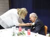 Mary Beth Giannelli pins a corsage on the Fountains at RiverVue resident Bob Pitofsky.