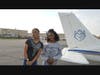 Kennedie Haynes and London Fultz, freshmen at Hazelwood East High School, pose by a St. Louis University aircraft at the Girls in Aviation event.