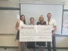 FLAG Award winner Kelly Preston, a social studies teacher at Urban Assembly Institute of Math and Science for Young Women in Brooklyn (second from left), with The FLAG Award for Teaching Excellence's Risa Daniels, Laura Twersky, and Glen Fuhrman