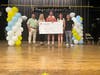 FLAG Award winner Aaron Lober, a STEM educator at 28Q157 Halsey Middle School 157 in Queens (center)