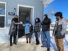 Lori Leonard, CEO, Habitat for Humanity of Burlington and Mercer Counties (far left), presents the Belfquih family with keys to their new home in Palmyra.