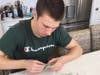 Student volunteer Mike Brown creates clay hearts, which are shared with hospice patients and bereaved family members as a token of comfort. 