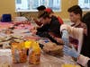 Several students including graduating seniors Zac Lynch (second in from right, red/brown shirt) and Mike Brown (next to Zac, black sweatshirt) create fall-themed treats for Samaritan’s Giving Thanks, Preserving Memories annual event.
