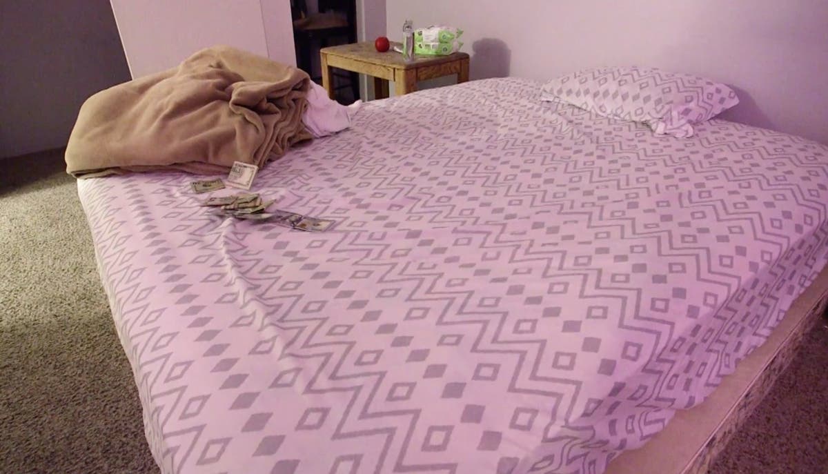 Money on the bed of a room where the FBI rescued two Colorado girls ages 5 and 3 months from sex trafficking. 