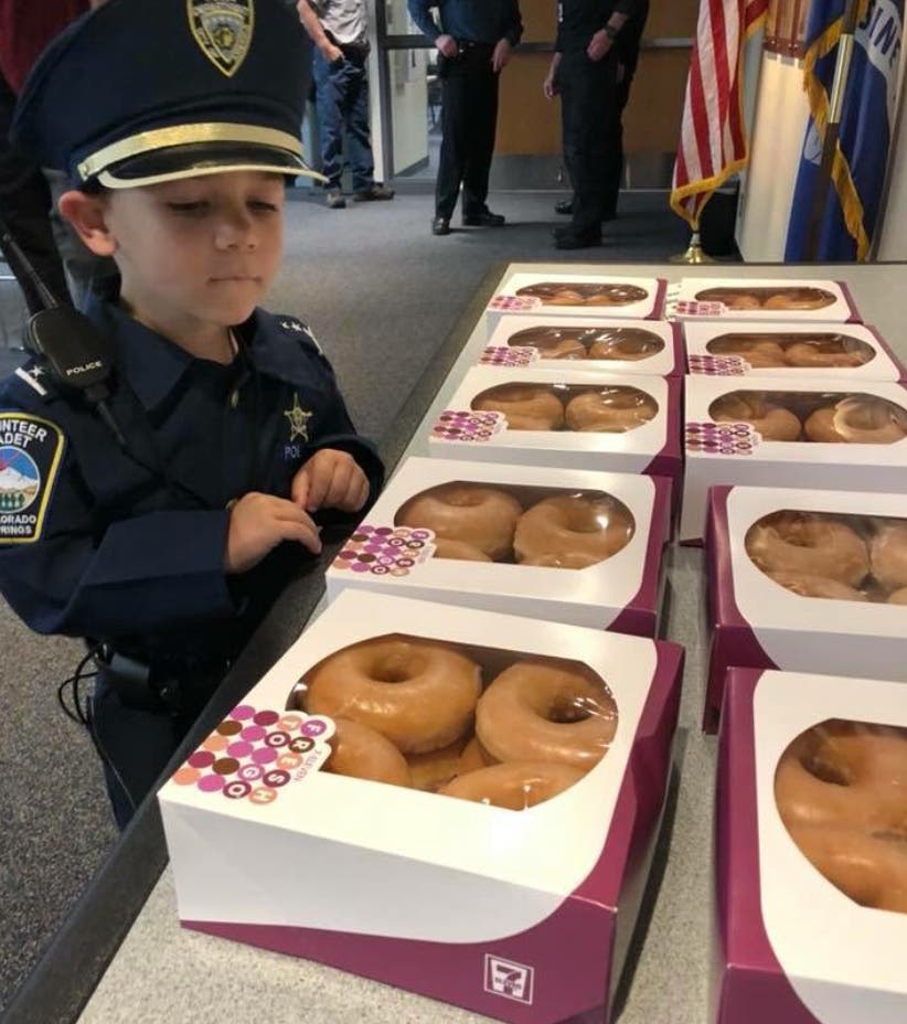 Joshua Salmoiraghi, 3, checks out the donut supply at the Colorado Springs Police Dept. via CSPD