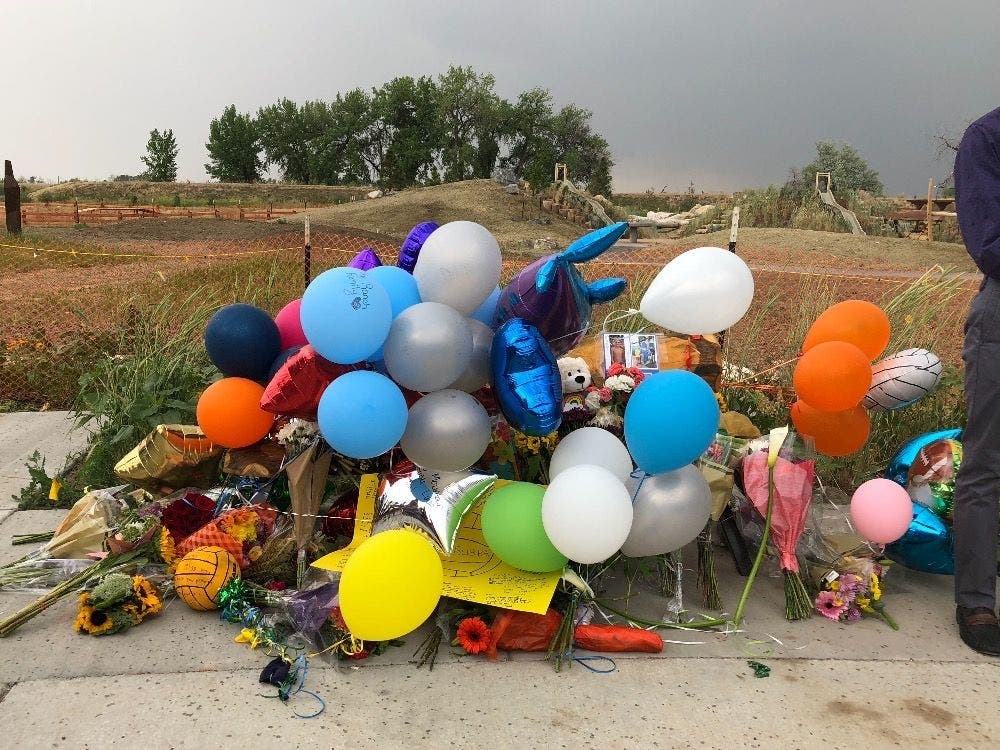 Balloons and stuffed animals mark a makeshift memorial for Bigelow family members. Via GoFundMe