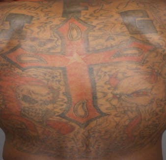 Distinctive tattoos on suspect Jerome Lucas via Denver Police Dept. Distinctive tattoos on suspect Jerome Lucas via Denver Police Dept.