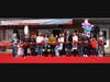 Ms. Cai Sun and Ms. Leia Cheng (center), the owners of Toudaotang Herbal Head Spa, perform the official ribbon cutting on Saturday, March 22nd.