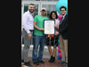 Kennedy and Shannon (right) present El-Hage (left) and Cassese a citation on behalf of the Connecticut State General Assembly.