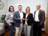 United Insurance Group's owners, President Rachel Gaudet, and Chief Operating Officer, Scott Gaudet (holding scissors), were joined by Barry Lee Cohen, CEO of the Amity Chamber of Commerce, and State Rep. Kathy Kennedy.