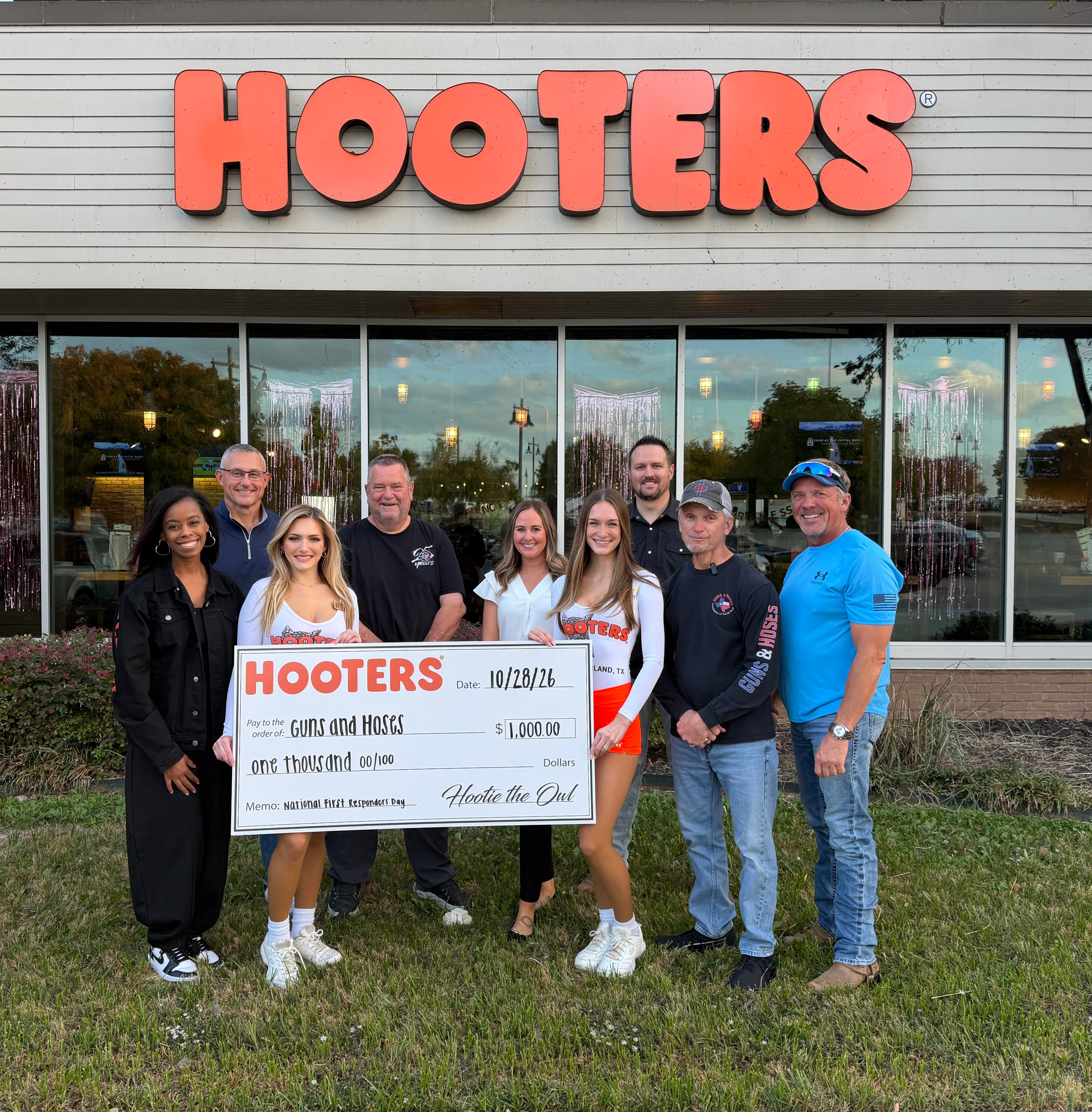 Hooters Presents Donation to Guns and Hoses Foundation on National First Responders Day