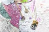 Fallen pain chips are the turned into Rebel Nell jewelry by a team of creative designers.