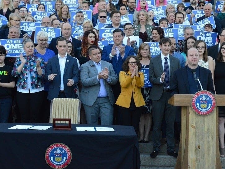 Gov. Jared Polis has signed a bill that bans conversion therapy for minors.