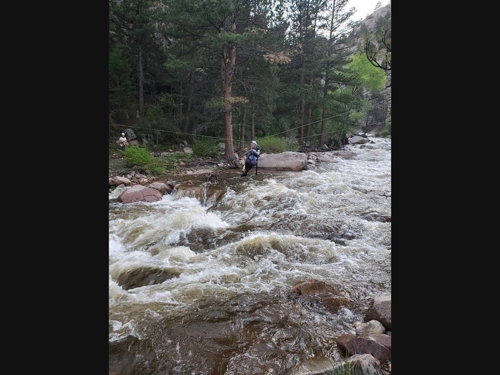 Search and rescue crews spent around six hours trying to help reunite a family after a woman was swept away along North Saint Vrain Creek, officials said.