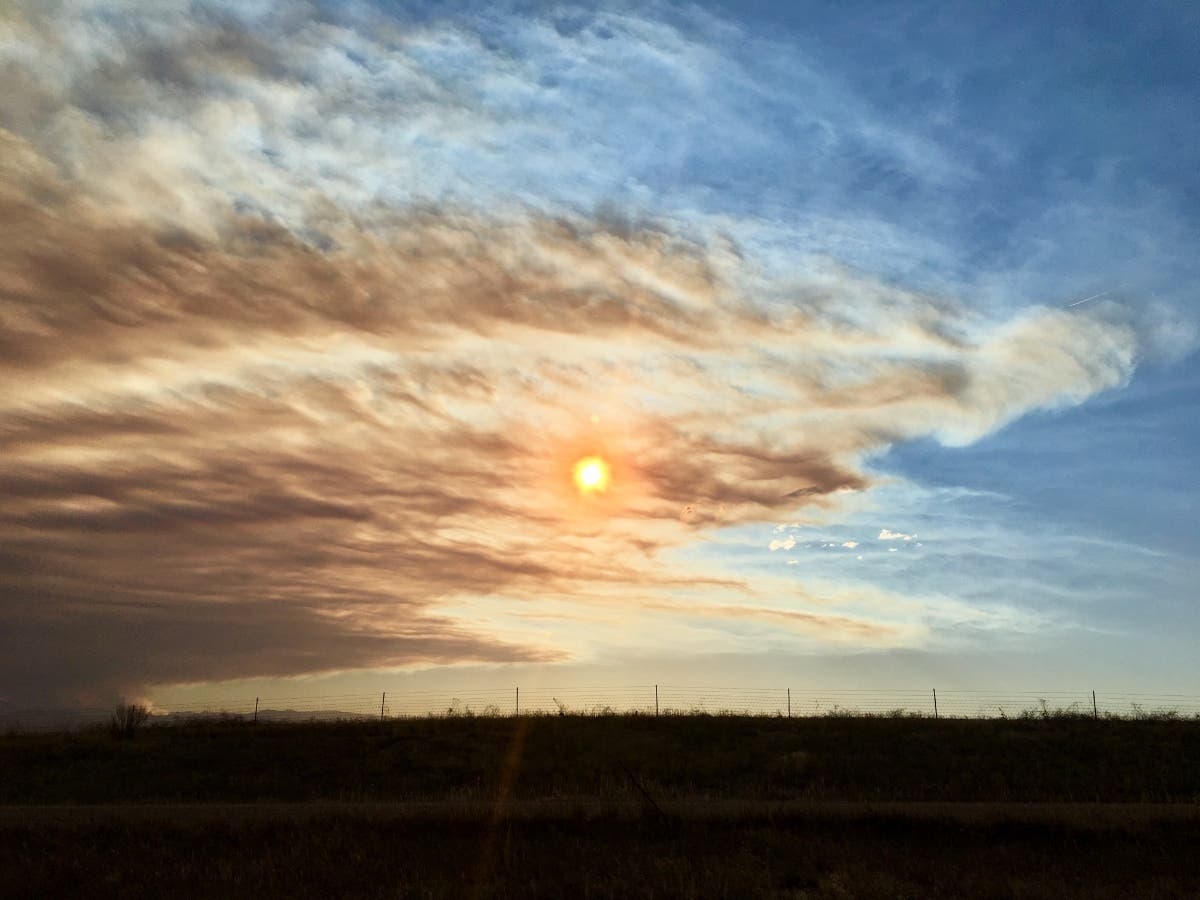 Fine particulates in smoke can exacerbate COVID-19 symptoms, according to public health officials.
