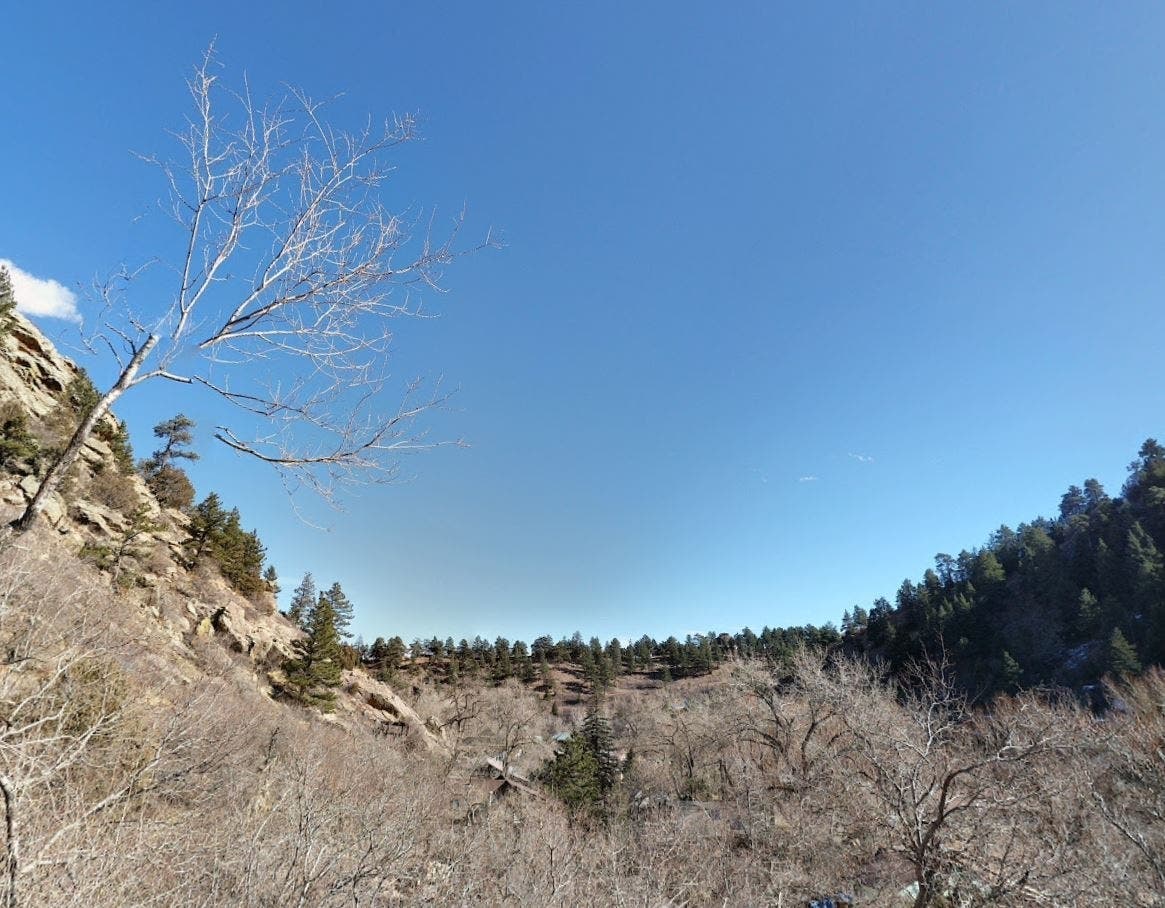 A 49-year-old woman was found dead after her car was discovered near Eldorado Springs Drive, officials said.