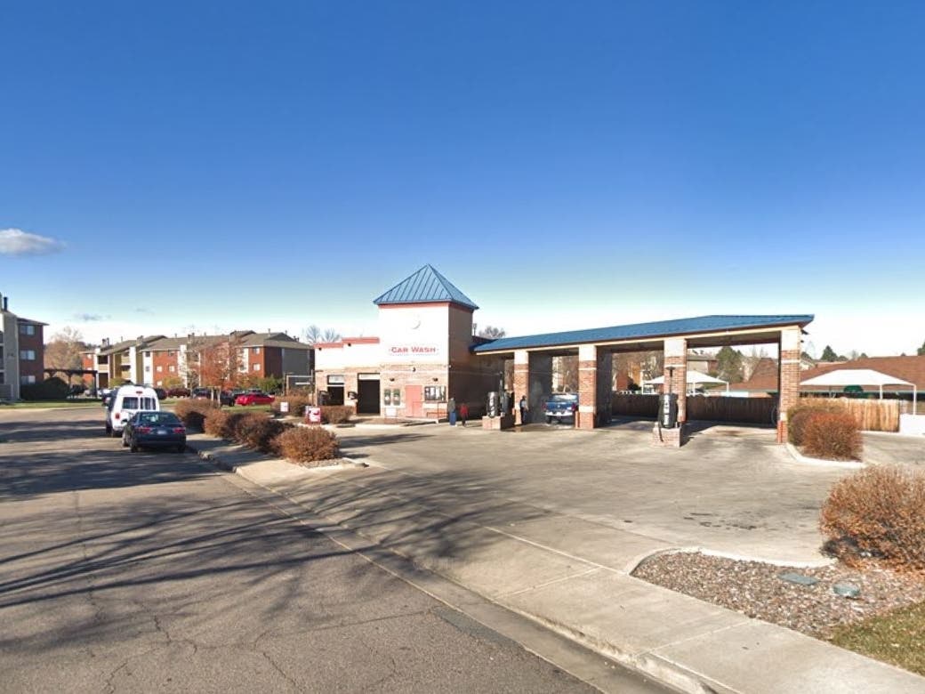 A man attacked a woman and stole her vehicle at the Atlantis Car Wash in Littleton, police said.