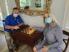 Manatee Habitat Critical Construction Manager Steve Reinfeldt and ReStore Director of Operations Karen McElry at the new living room game table.