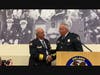 Former Orland Fire Chief Robert M. Buhs (L) shakes hands with Orland Fire Chief Michael Schofield, after the dedication of the district's training center in Buhs' honor.