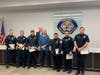 Cardiac Arrest survivor Kenneth Wilkas (front 4th from left) poses with some of the fire and police officers who saved his life after he suffered a heart attack on November 26, 2022. OFPD Board President John Brudnak (backrow). 