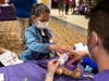 Participant performs surgery on a teddy bear.