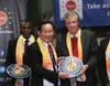 Dr. Hong, Tao-Tze, president of FOWPAL, center, presents the compass clock of conscience, celebrating the United Nations' designation of April 5 as the International Day of Conscience to Rhode Island Lieutenant Governor Daniel Mckee at the UN in New York.
