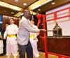.Julien Le Blanc, attaché at the Permanent Mission of Dominica to the UN, rings the Bell of World Peace and Love at a gala dinner in New York, Feb. 19, 2020. The bell-ringing ceremony aims to awaken people’s conscience for a better world.