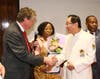 Dr. Hong, Tao-Tze, president of FOWPAL, right, is honored by Rhode Island Lieutenant Governor Daniel Mckee for fostering a culture of conscience, love, and peace at a gala dinner in New York, Feb. 19, 2020.