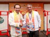Dr. Hong, Tao-Tze and Prime Minister Briceño warmly interact during the bell-ringing ceremony.