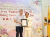 California Assemblymember Patrick Ahrens presents a certificate of recognition to Dr. Hong Tao‑Tze.