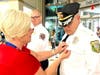 A member of the Voorhees Police Department receives a First Responders’ pin from Sharon Wenner of Samaritan.
