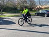 Officer Kevin Crain of the CHPD takes the new electric bike for a test ride in front of Y.A.L.E. School Cherry Hill. 