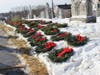 Wreaths are placed at the resting places of veterans at St. Peter's Church cemetery in Belleville on Saturday.