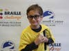 Apprentice group winner, Benjamin Silva, poses in front of a backdrop at the New England Regional Braille Challenge on February 1st.