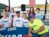 Olympic swimmers signing autographs at a Swim Across America Atlanta open water swim event. This year, more than 10 Olympic swimmers are expected to be at the event at Lake Lanier on Saturday, September 24.