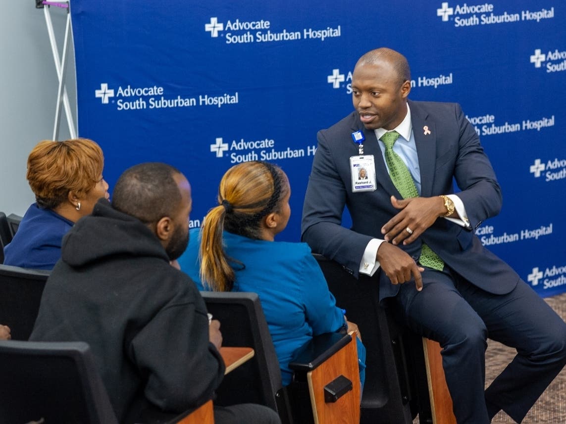 Advocate South Suburban Hospital President Rashard Johnson chats with  Advocate Workforce Initiative participants. 