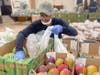 Advocate Trinity volunteers sort and distribute fresh produce to eligible Food Farmacy patients with metabolic conditions. 