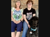 Cancer survivor Karen Daggett with her granddaughter Anastasia Shriver and granddog Zeki. 