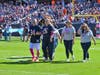 Patti Hasemann and her family make the triumphant walk to ring the bell.  