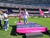 Breast cancer survivor Kandee Koehler rings the bell to the cheers of over 60,000 Chicago Bears fans. 