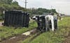 An overturned food trailer leaking propane gas forced the closure of State Road 60.