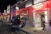 A parked SUV was propelled into a building in Clearwater after being struck by a hit-and-run driver.