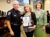 Laurice Hachem, who donated the funds for the center, with Chief Ken Alfano and Mayor Mel Jurado. 