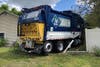 An out-of-control garbage truck plowed through their yard on Tinsmith Drive.