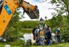  The Clearwater Parks and Recreation Department lifted the 2-ton manatee out of the water with a backhoe. 
